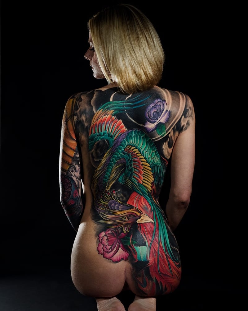 Tattoo artist at work sketching a design