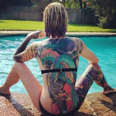 Color bird and floral back tattoo
